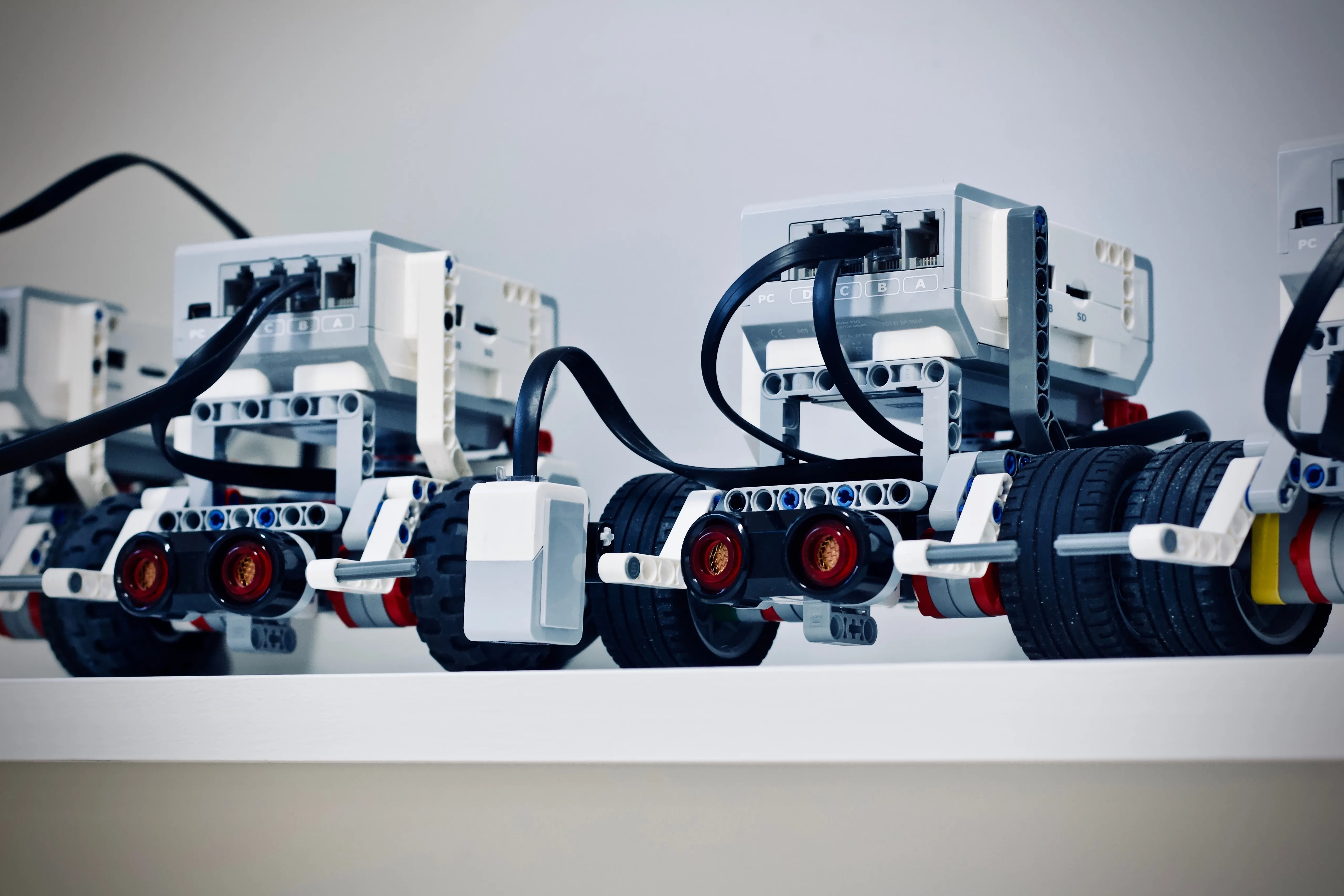 Close-up of educational robot kits on a shelf.